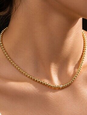 Gold Beaded Necklace with Single Crystal Accent